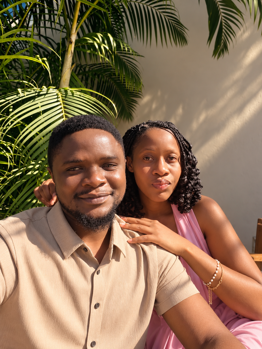 Lawrence and Blessing under the palm fronds